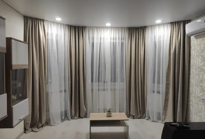 Sheer and blackout cutains install in living room