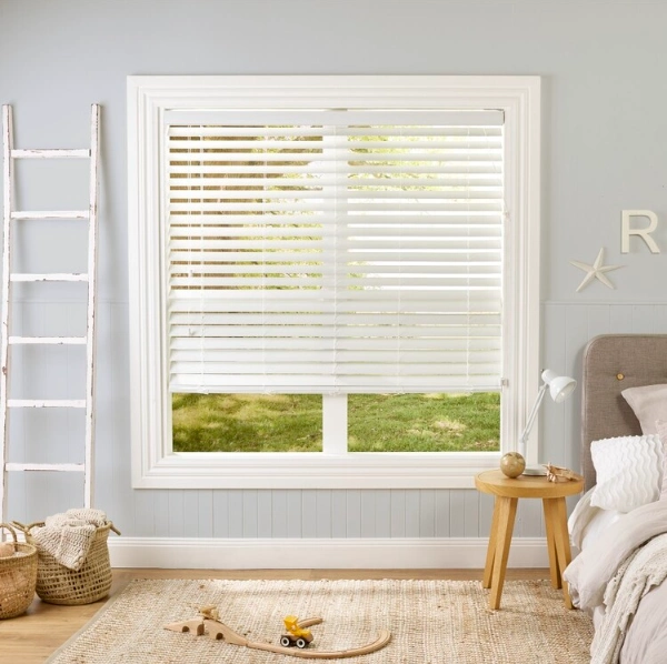 Faux wood window blinds in bedroom
